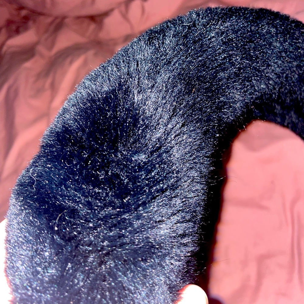 Black, fuzzy steering wheel cover